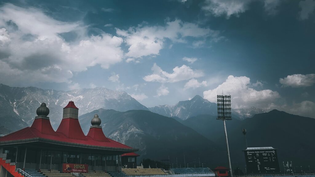 Dharamshala cricket stadium with the Dhauladhar mountain range in the background