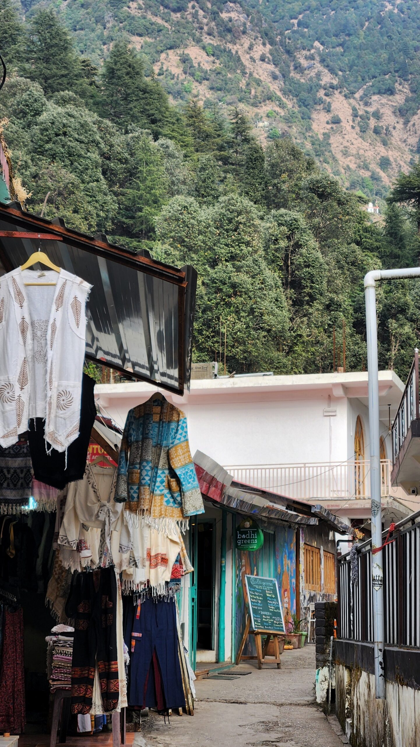 Quiet residential lane in Dharamshala with local homes and small shops, reflecting everyday life around long-stay homestays in Dharamshala