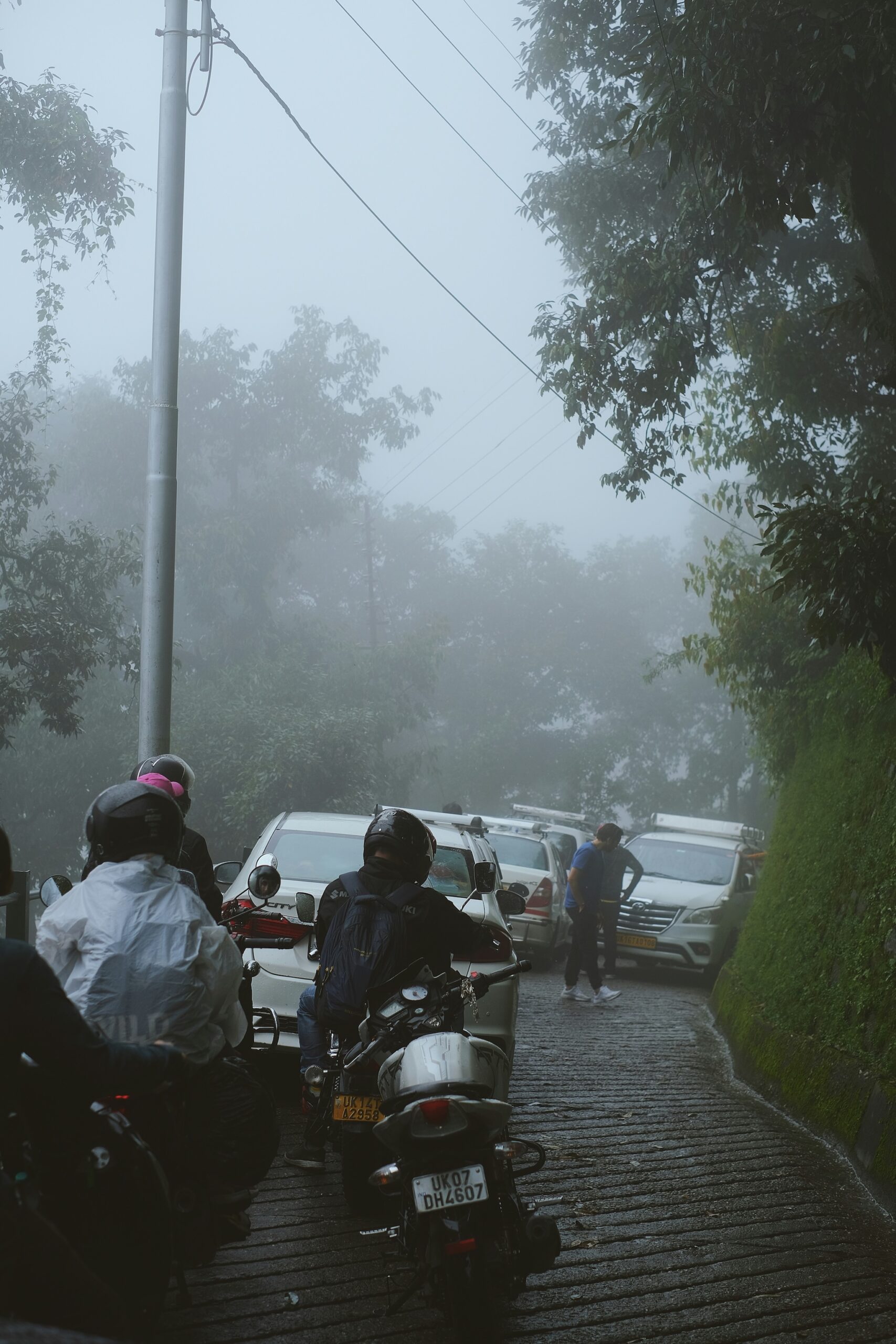 Minor traffic slowdown on a Dharamshala road during the monsoon season