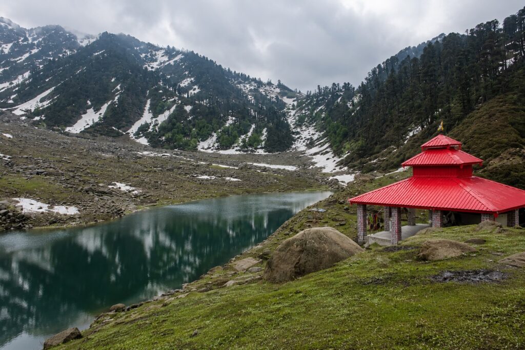Best places to visit in Dharamshala including Kareri Lake surrounded by the Dhauladhar mountains