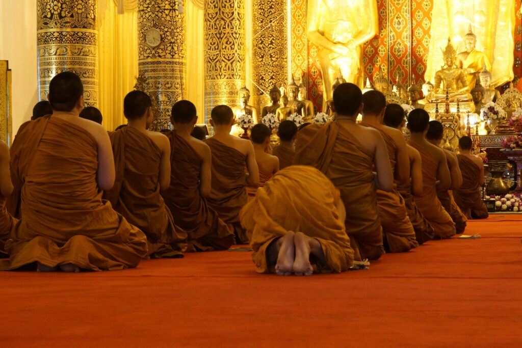 Monks seated in prayer inside one of the monasteries in Dharamshala, reflecting daily Tibetan monastic life