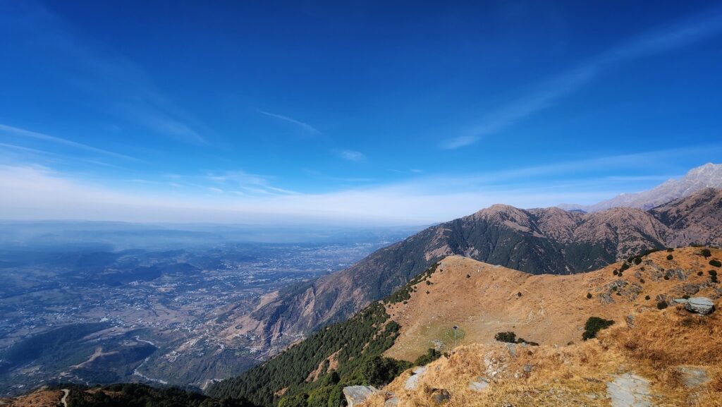Panoramic ridge view overlooking Kangra Valley during the Himani Chamunda trek in Dharamshala