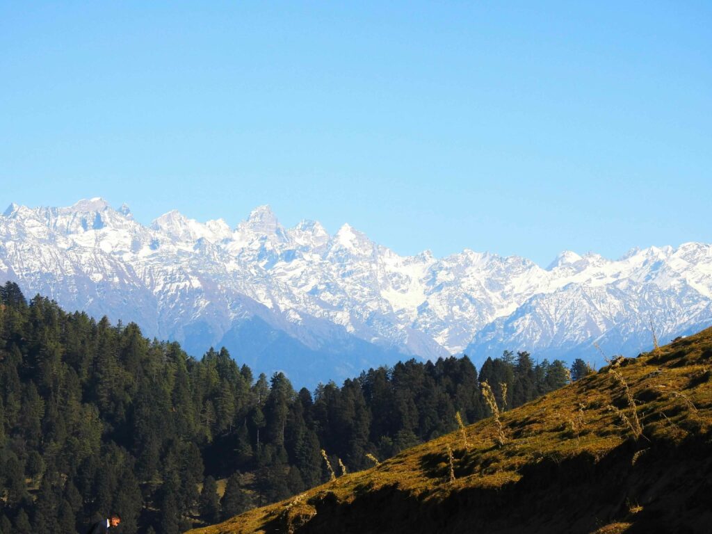 Dhauladhar mountain range view from a quiet ridge representing offbeat places in Dharamshala beyond McLeod Ganj
