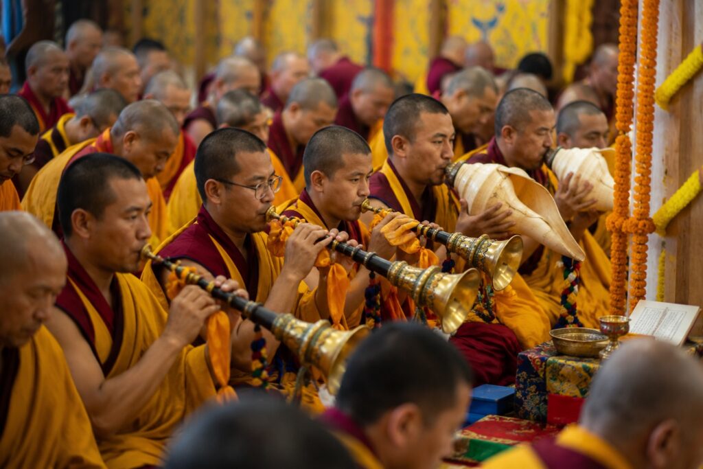 Tibetan monks performing ceremonial music during the Dalai Lama 91st birthday in McLeodganj
