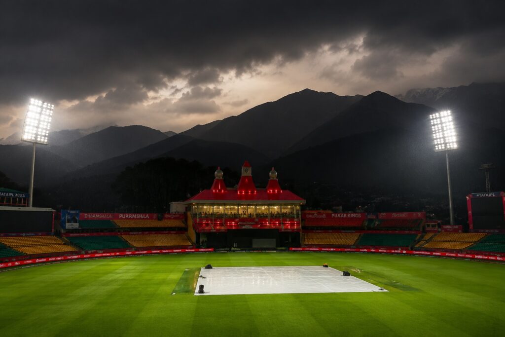 IPL Qualifier 1 Dharamshala at HPCA Stadium under dramatic storm clouds and floodlights