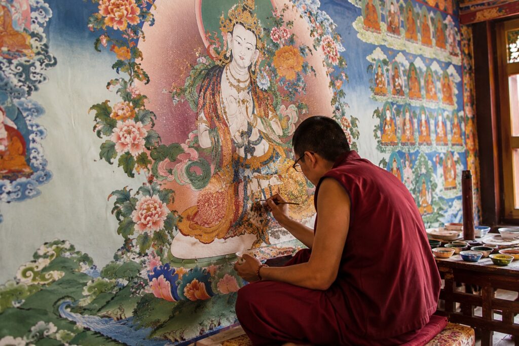 Where to stay for Dalai Lama Birthday 2026, Tibetan monk painting traditional thangka art in Dharamshala