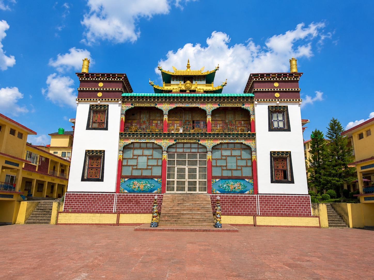 Sherabling Monastery courtyard and temple building on a clear summer day near Bir in Himachal Pradesh