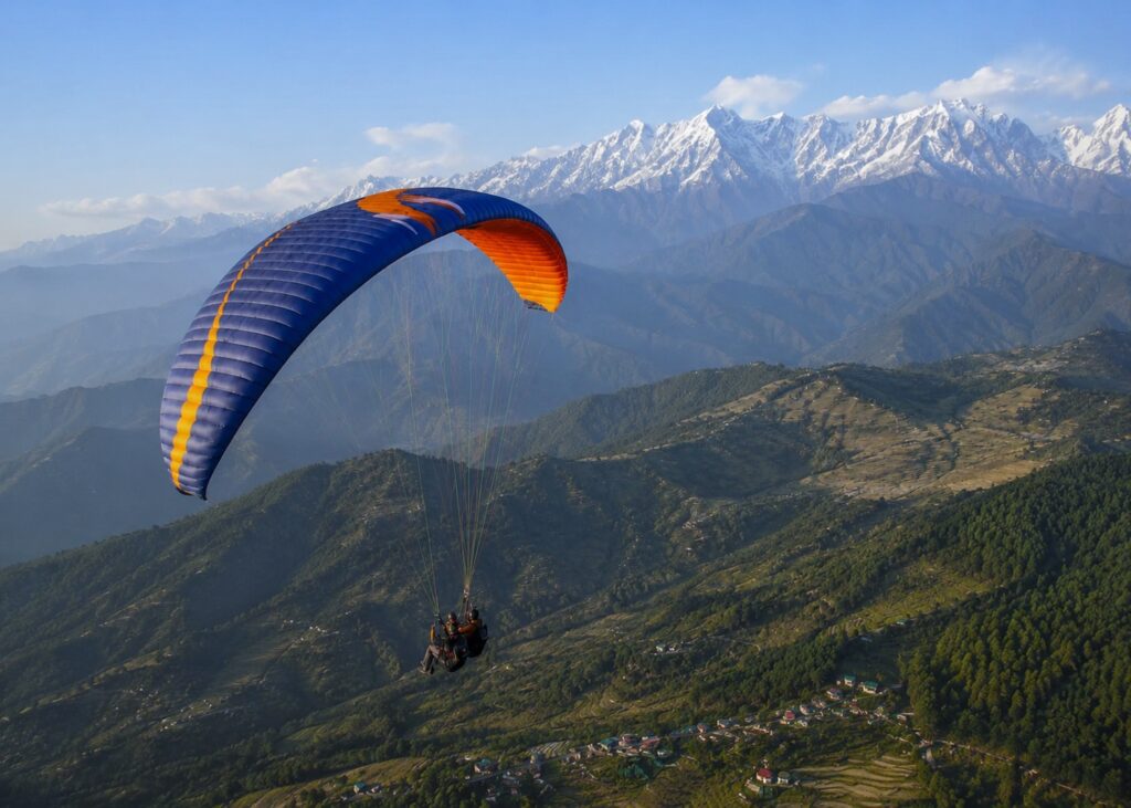Tandem paragliding over Bir Billing with panoramic views of the Dhauladhar mountains, one of the top things to do in Bir Billing.